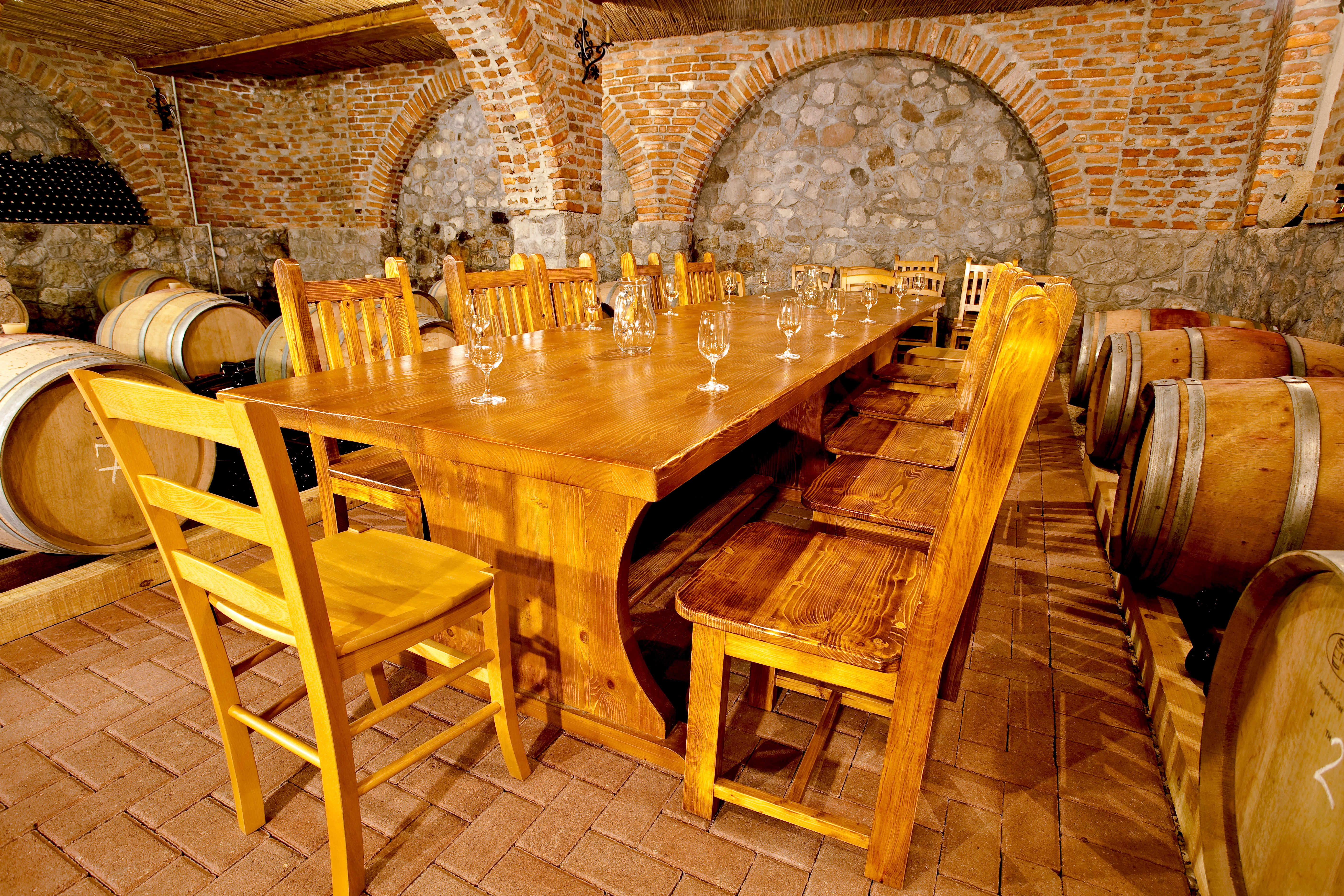 a table set up for wine tasting in the cellar of one of albuquerque's wineries