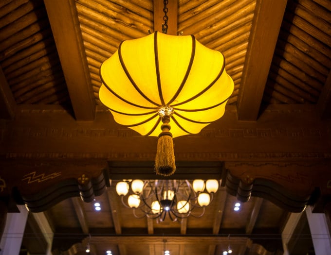 large yellow light fixture in hotel lobby