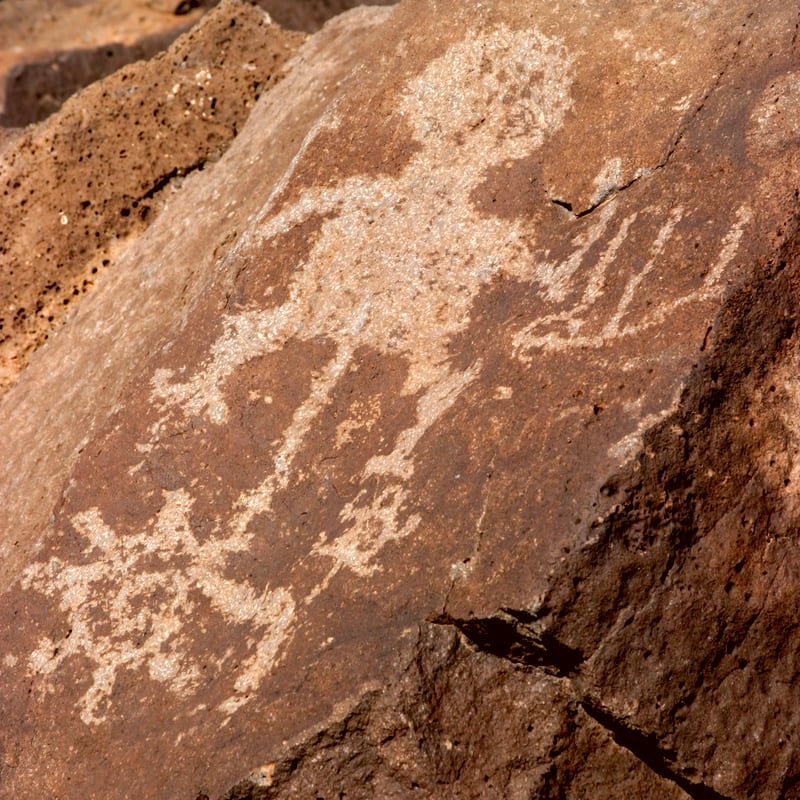 a native petroglyph etched on a rock at a state monument