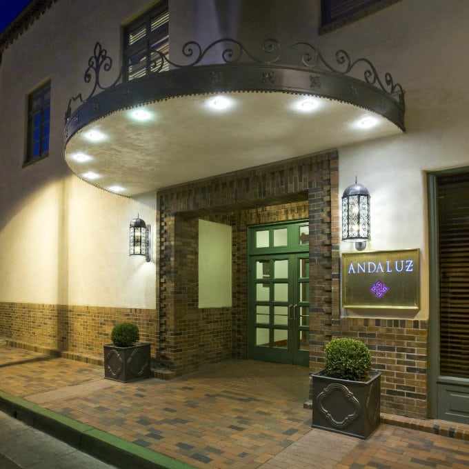 Hotel Andaluz main entrance exterior photo with awning and sign. Original brickwork