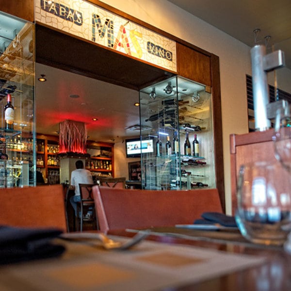 interior photo of MAS tapas y vino. Their wine bar is pictured here.