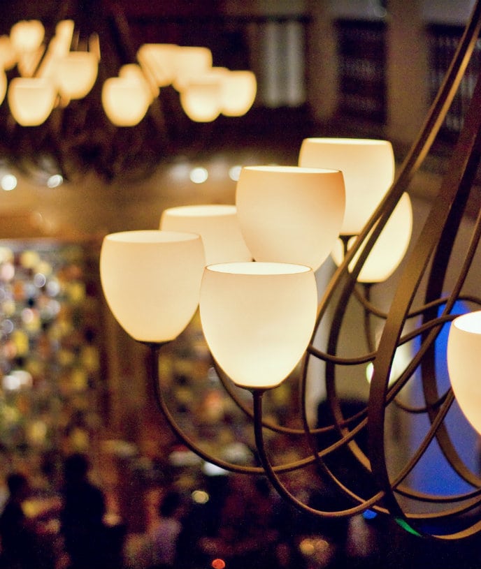 an elegant light fixture above the hotel lobby