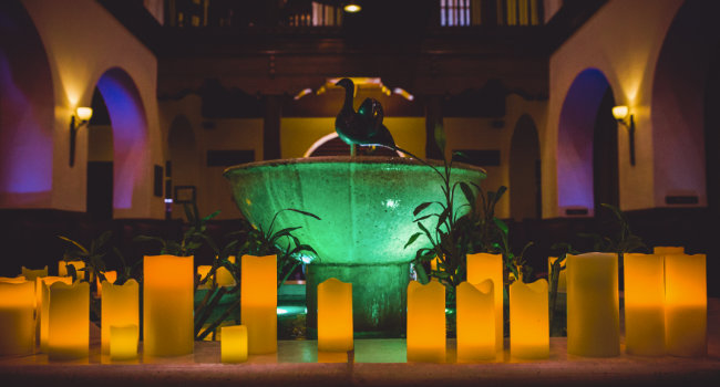 Hotel Andaluz lobby fountain darkened and lit with candles for a wedding event